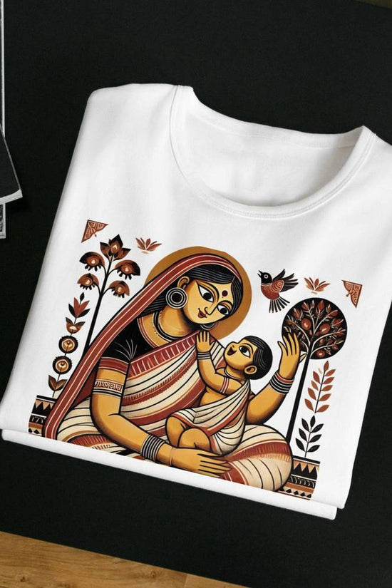 Janani Patachitra T-Shirt featuring a traditional Bengali heritage design with hand-drawn motifs of a mother and child. Made from 100% premium cotton for durability and comfort.