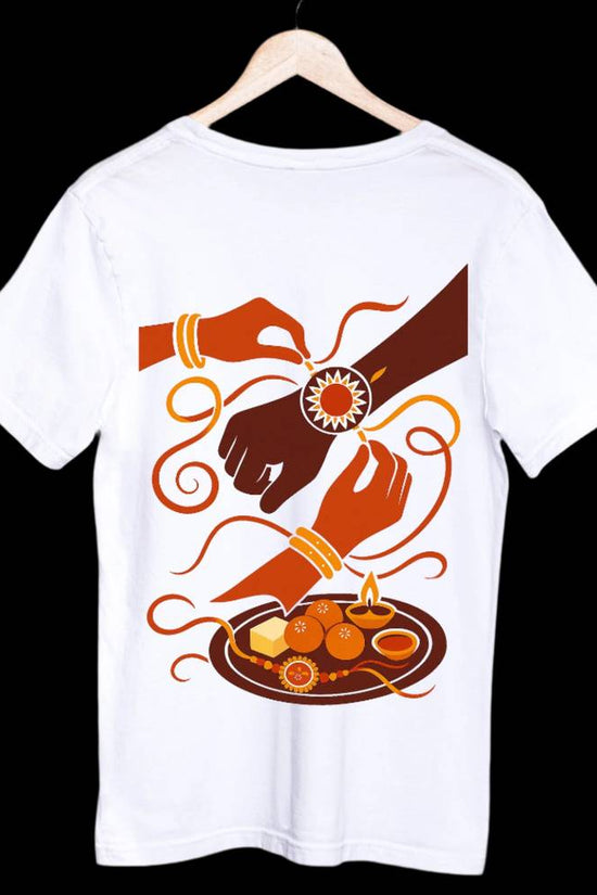 Rakhi T-Shirt - Raksha Bandhan Bond | Brother-Sister Art featuring a vibrant illustration of a sister tying rakhi on her brother’s wrist on white cotton fabric.