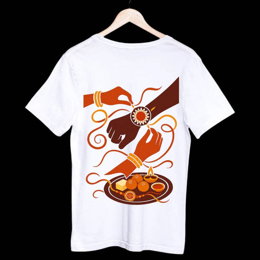 Rakhi T-Shirt - Raksha Bandhan Bond | Brother-Sister Art featuring a vibrant illustration of a sister tying rakhi on her brother’s wrist on white cotton fabric.
