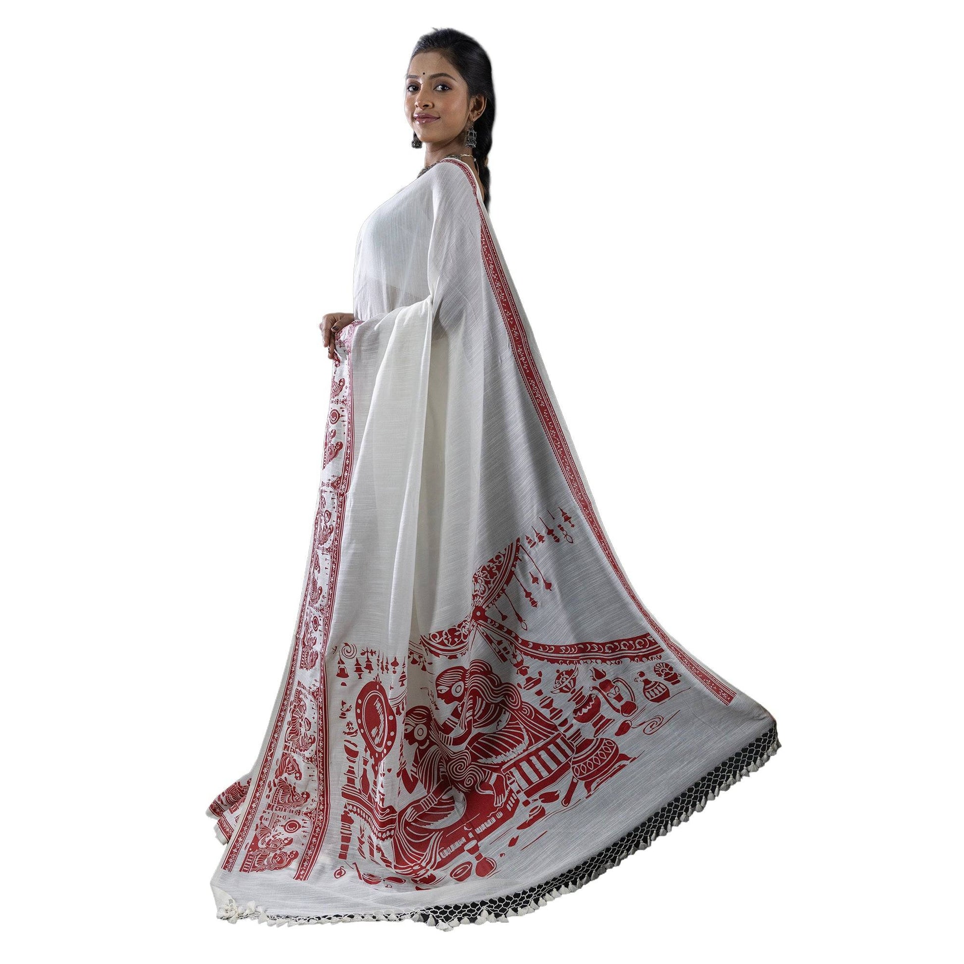 Sringer red on white printed khadi cotton saree with Kalighat Patachitra motifs, draped elegantly for traditional wear.