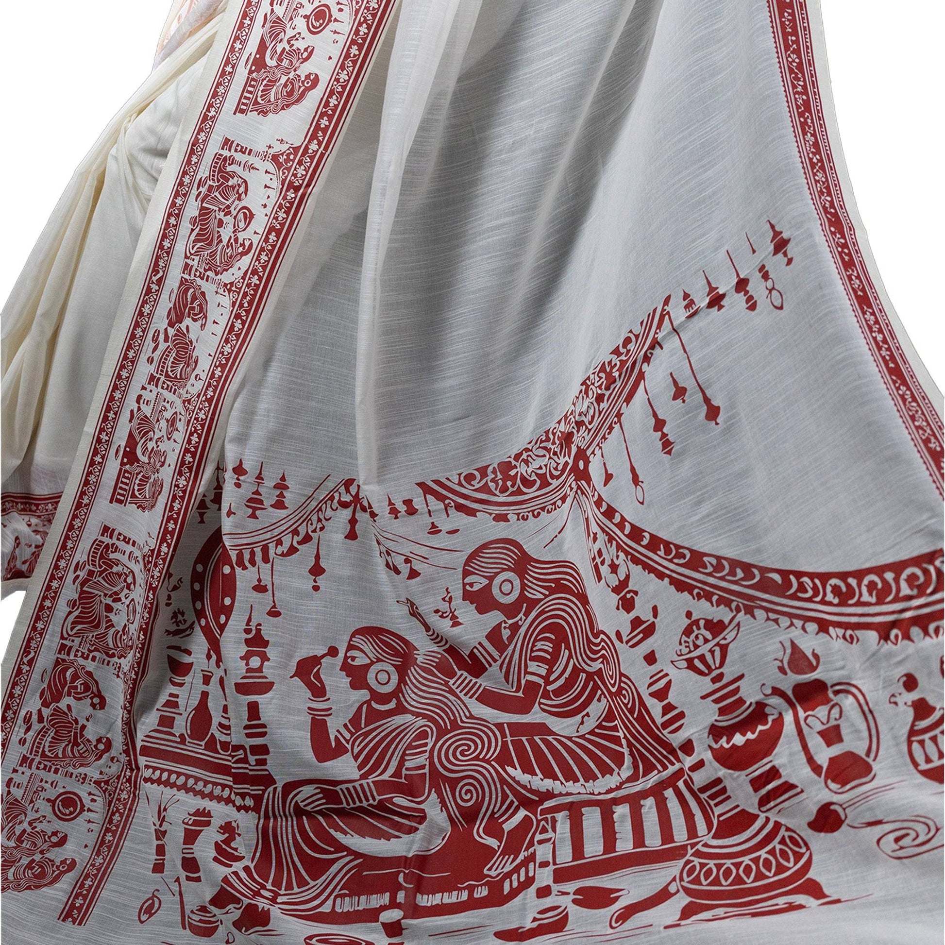 Close-up of Sringer khadi cotton saree showcasing intricate red Kalighat Patachitra artwork on white fabric.