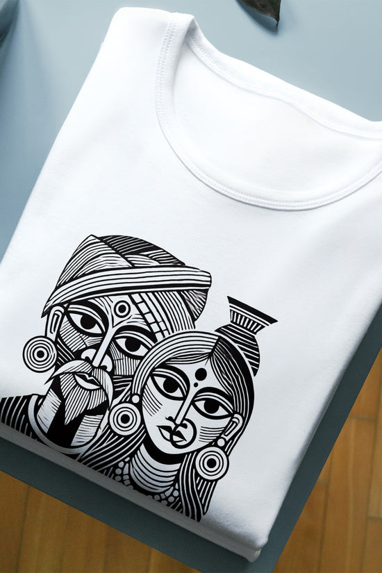 Artistic Graphic T-Shirt - Tribal Couple Design in black and white, folded neatly on a table, made from 100% cotton for art lovers.