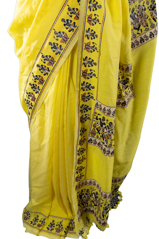 Close-up of yellow Tribal Dance Graphic Printed Saree showing detailed tribal motifs and border patterns in pure khadi cotton fabric.