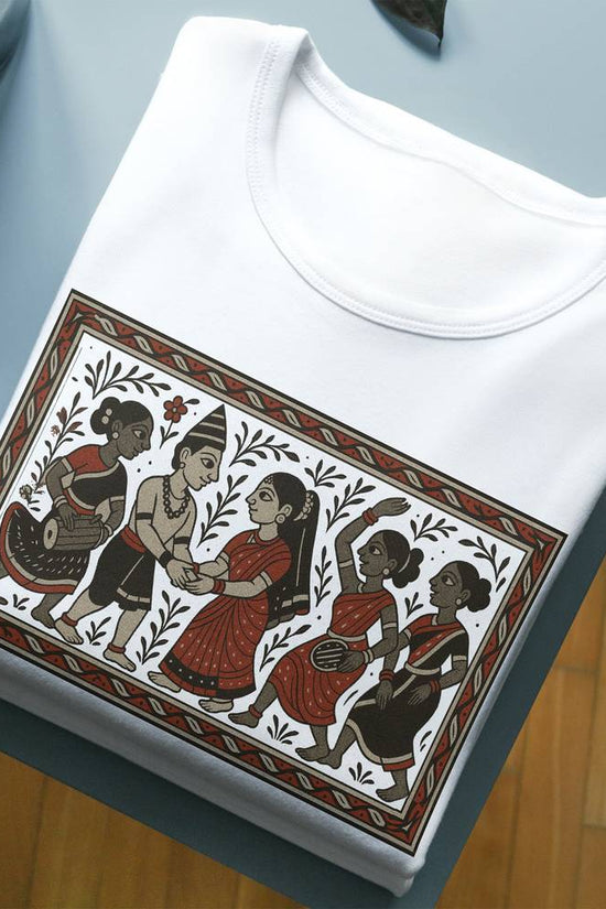 Tribal Wedding T-Shirt featuring Bengali Patachitra art style, folded neatly on a table; premium cotton fabric with vivid traditional graphic print.