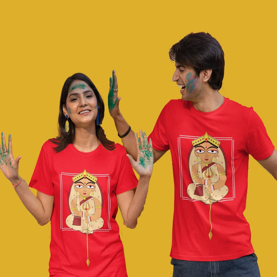 Uma Bengali Spiritual TShirt (Unisex) in vibrant red with a printed design of Goddess Uma, worn by a smiling couple celebrating with colors.