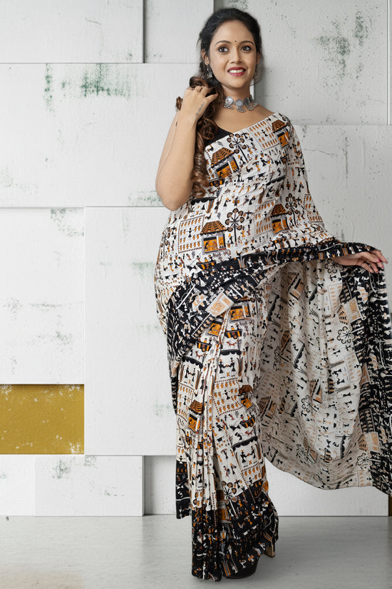 Warli Tales Saree - Tribal Art Cotton featuring Warli folk art patterns, perfect for cultural celebrations and ethnic fashion lovers.