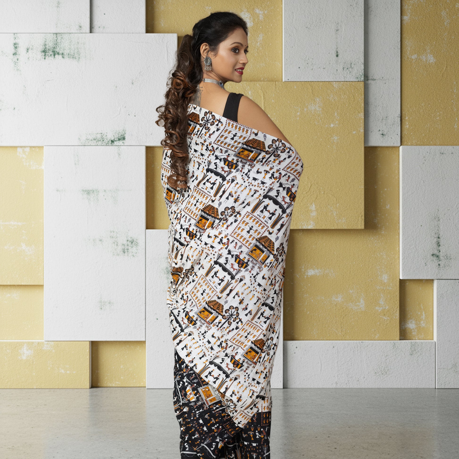 Warli Tales Saree - Tribal Art Cotton with full back view, highlighting the continuous tribal design and breathable cotton fabric.