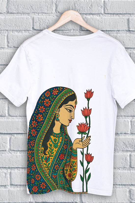 Whispers of the Lotus - Folk Art T-Shirt featuring a traditional Indian woman in vibrant attire admiring lotus flowers, symbolizing feminine grace.