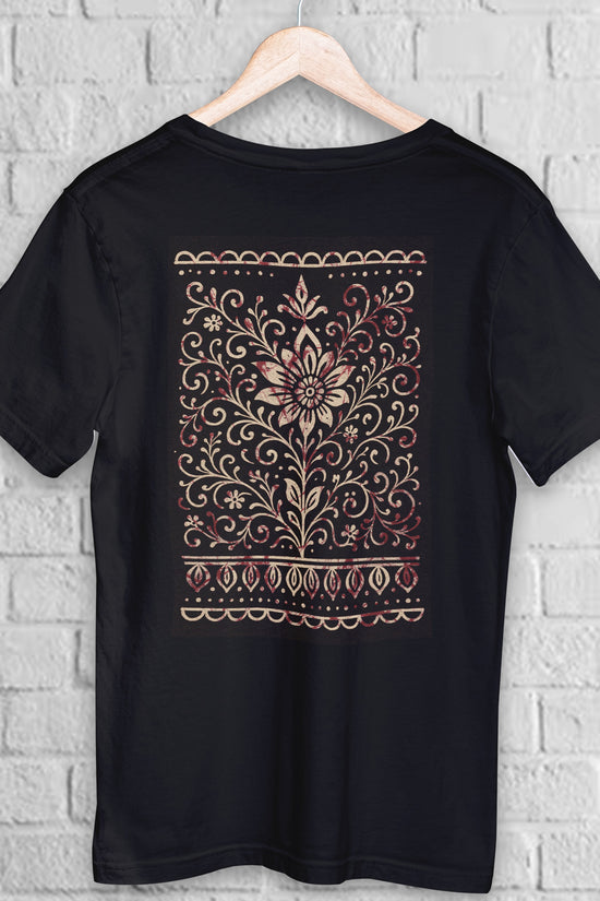 Bengali Alpona Art T-Shirt with intricate floral folk design in beige and maroon on black cotton fabric. Unisex ethnic wear inspired by Bengali culture.