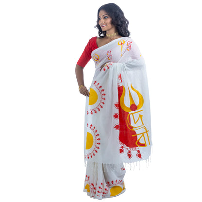 Durga Puja Debi saree pallu close-up showing trishul and Debi text with rising sun motif on khadi cotton