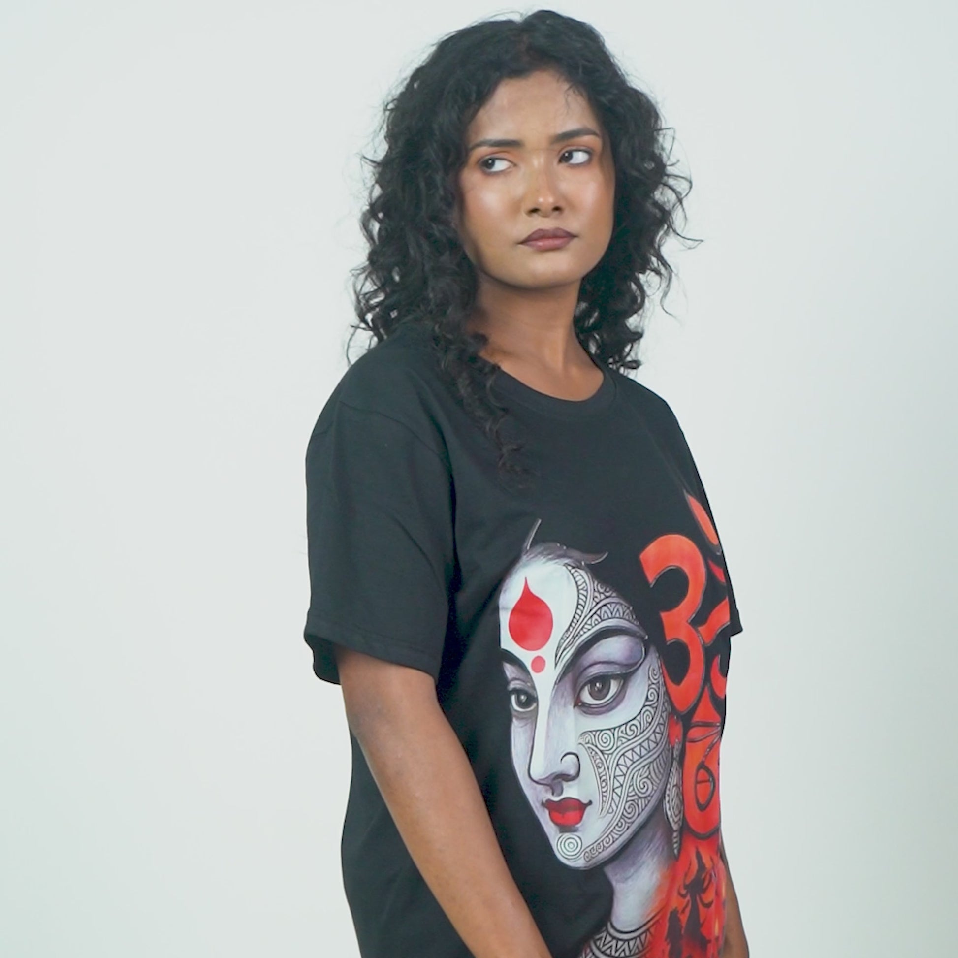 Om Shakti Durga Puja T-Shirt – Divine Art | Unisex, Regular Fit featuring bold Maa Durga face graphic with Om symbol in red on black cotton fabric.