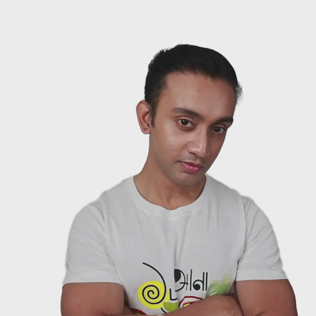 Man wearing a white 16 Ana Bangali T-shirt with vibrant Bengali graphic print, highlighting cultural pride. Unisex cotton tee by Smarteez.