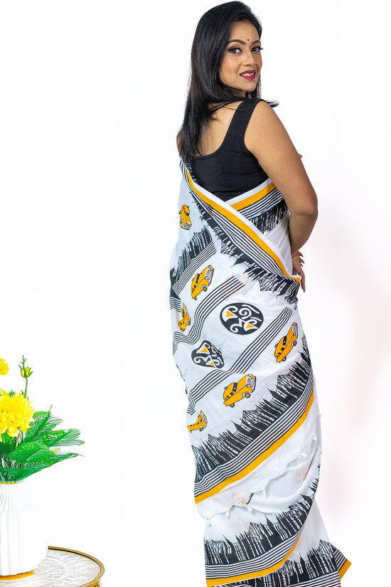 Kolkata Theme Cotton Saree in white with yellow taxi motifs and black cityscape design, ideal for festive and traditional Bengali wear.
