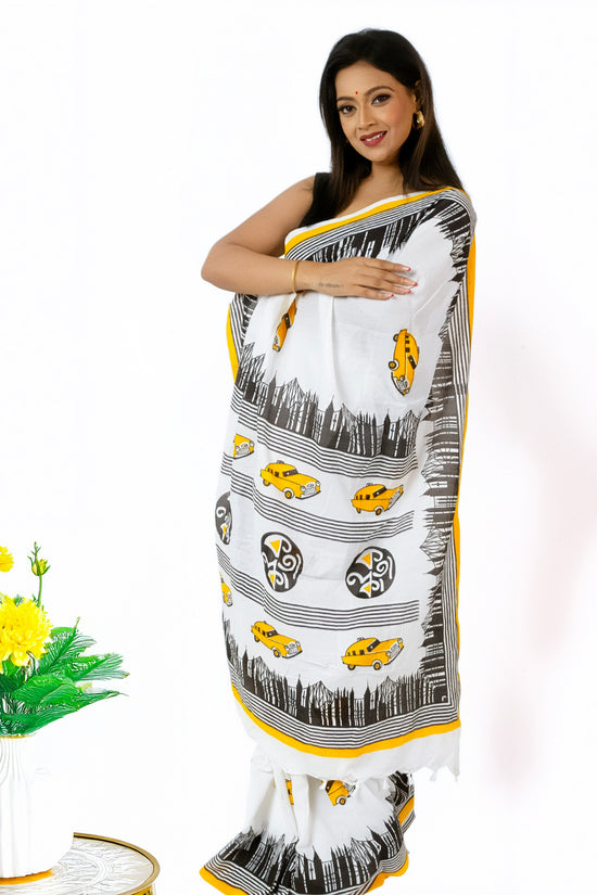 Kolkata Theme Cotton Saree in white with yellow taxi motifs and hand-painted cityscape, perfect for festive wear and Bengali cultural celebrations.